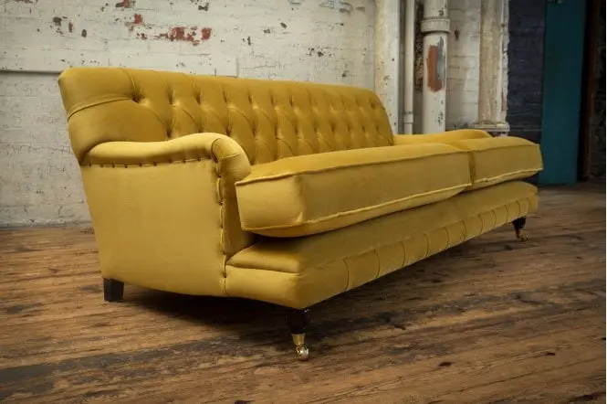 Side Angle With Three Legs View of Harvard Chesterfield Sofa in Yellow - Styled in a Room