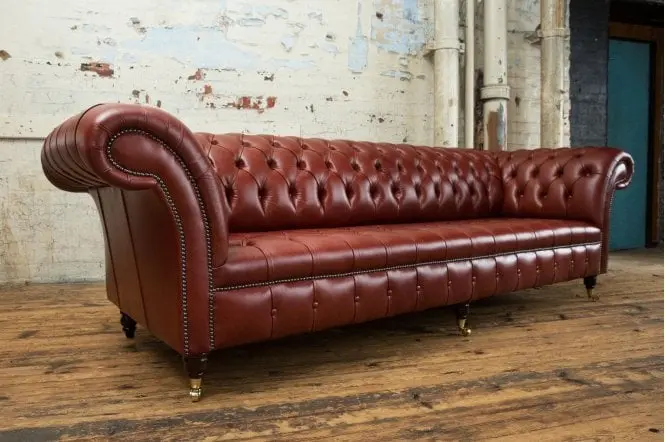 Side Angle With Four Legs View of Montana Chesterfield Leather Sofa - Styled in a Room