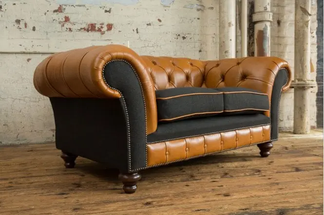 Side Angle With Three Legs View of Naunton Chesterfield Sofa - Styled in a Room